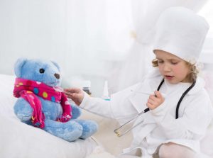 Little girl playing doctor