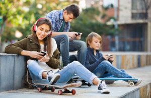Teenagers with smartphones