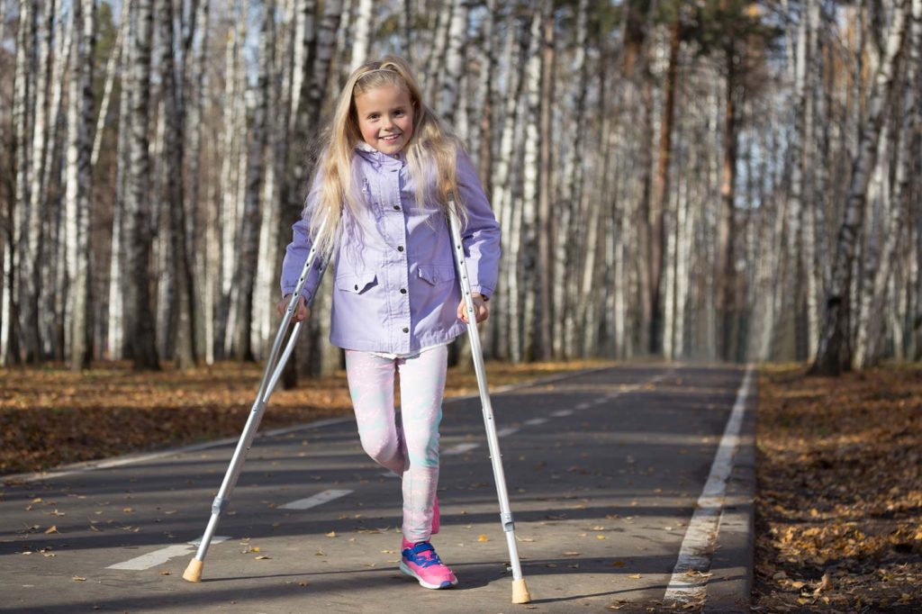 Girl with crutches