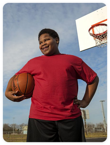 Teenager playing basketball 2